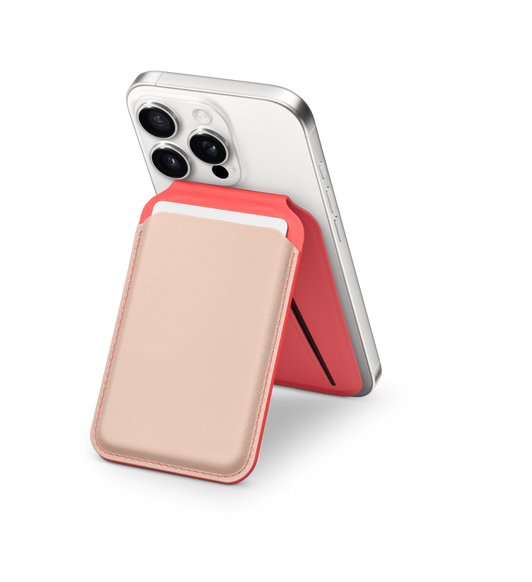 Satechi Magnetic Wallet Stand, unfolded, Sunset Coral colour, Transcendent Pink front card slot, attached to back of white iPhone, card inserted