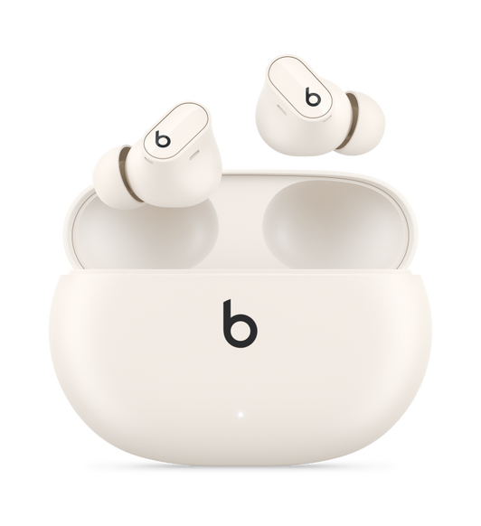 Beats Studio Buds + True Wireless Noise Cancelling Earphones in Ivory, with Beats logo, above convenient charging case.